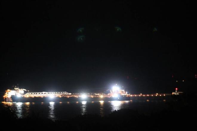 At some point during the night the freighter Sam Laud pulled in beside the American Spirit and using offload equipment, began to pass the iron ore from one freighter to another.